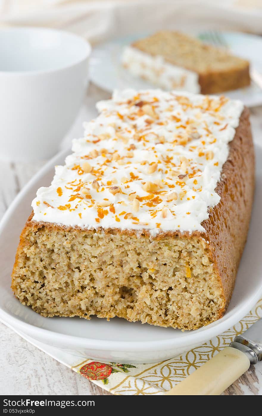 Orange cake with cream cheese frosting, closeup