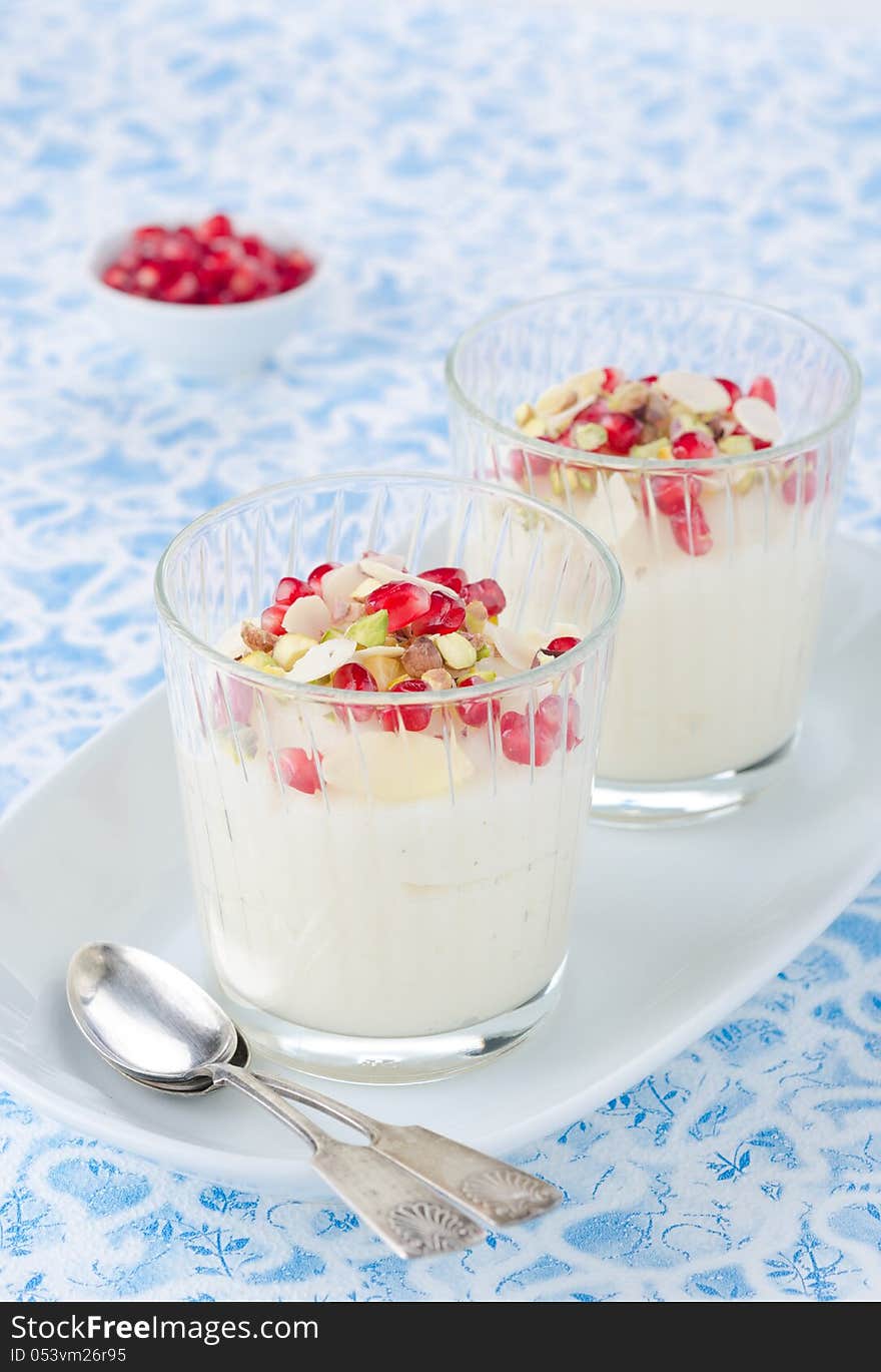 Semolina dessert with pomegranate seeds and pistachios