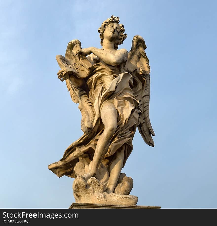 Statue of an angel standing on the bridge leading to the Castle Sant'Angelo, Rome. Statue of an angel standing on the bridge leading to the Castle Sant'Angelo, Rome