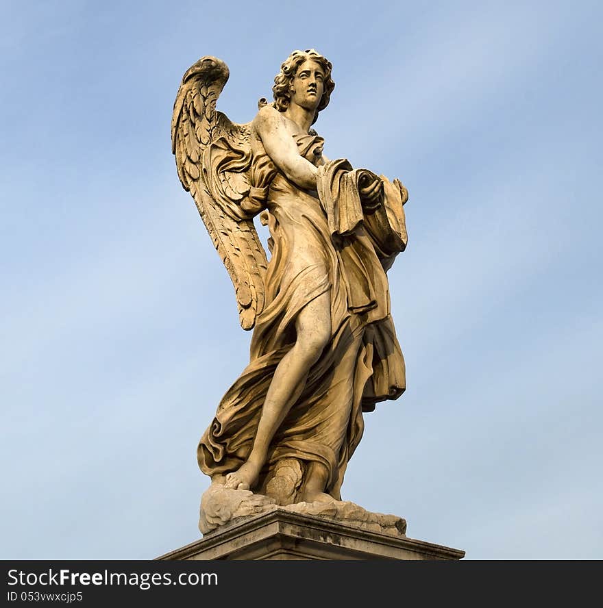 Statue of an angel standing on the bridge leading to the Castle Sant'Angelo, Rome. Statue of an angel standing on the bridge leading to the Castle Sant'Angelo, Rome