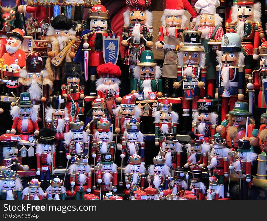 Wooden Figures on a Colourful Christmas Market Stall. Wooden Figures on a Colourful Christmas Market Stall.