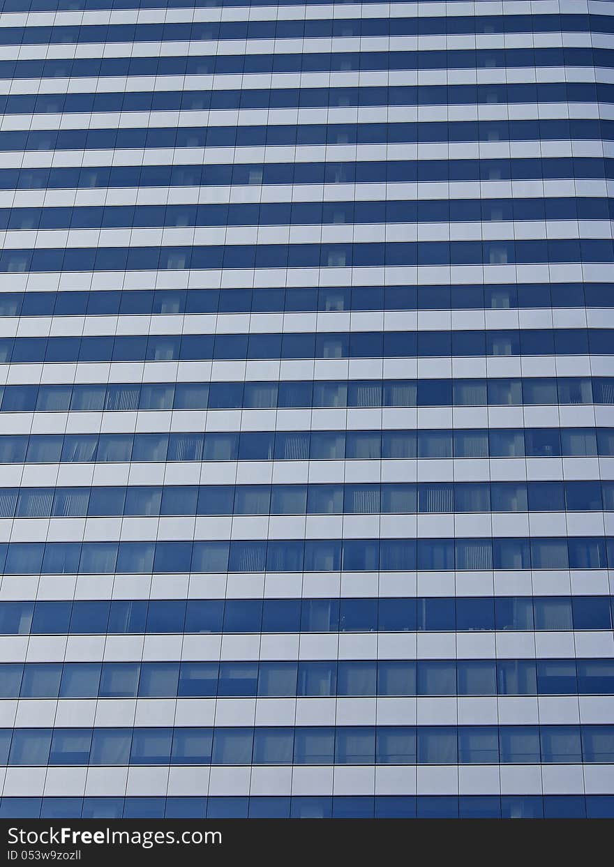 Glass surface on office building in sunshine. Glass surface on office building in sunshine