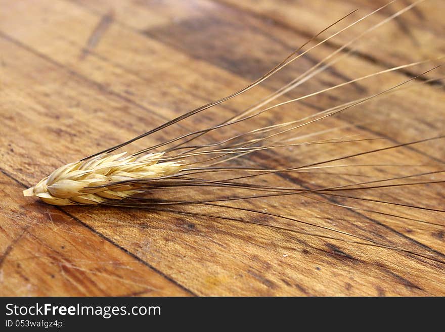 Old worn table with piece of grain