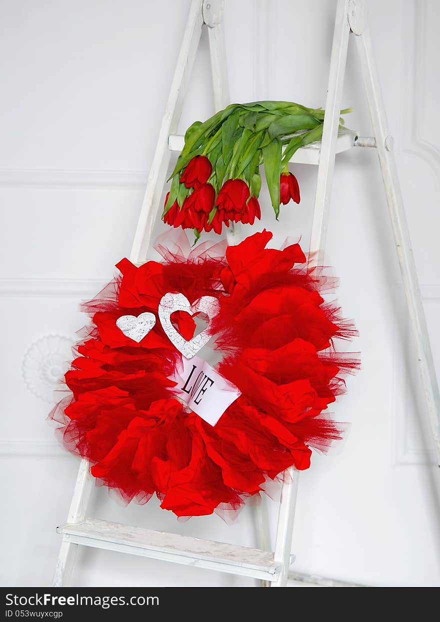 Love garland and red flowers