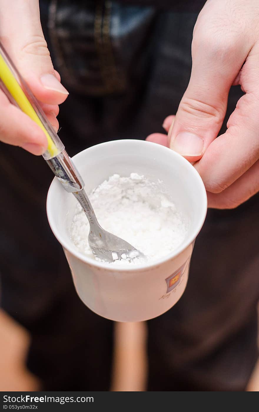 Preparing simple royal icing from sugar and water. Preparing simple royal icing from sugar and water