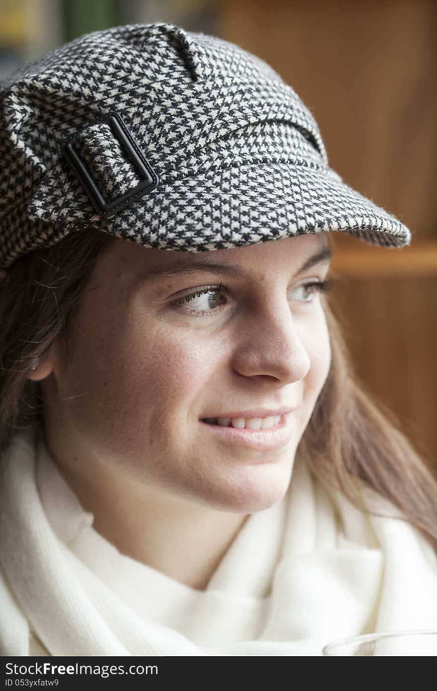 Portrait of a young woman staring straight ahead into the camera. Portrait of a young woman staring straight ahead into the camera