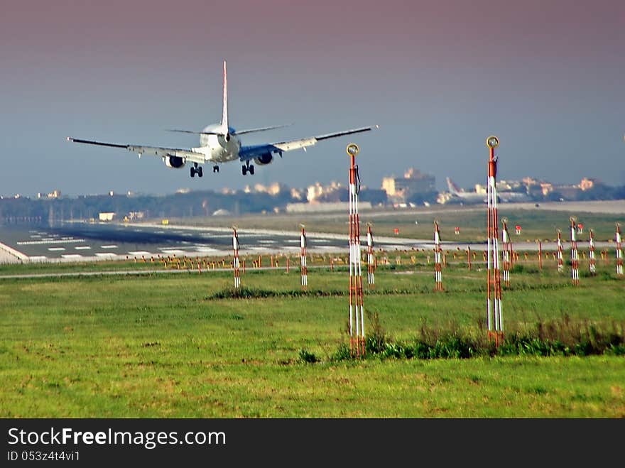 Passenger plane landing in the airport. Passenger plane landing in the airport