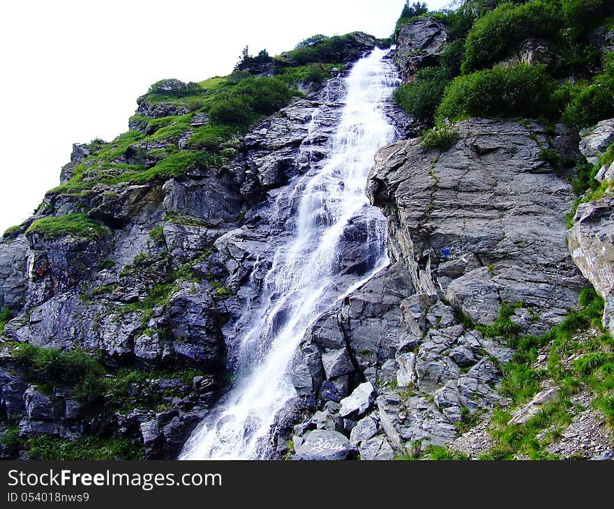 A waterfall is a place where water flows over a vertical drop in the course of a stream or river.