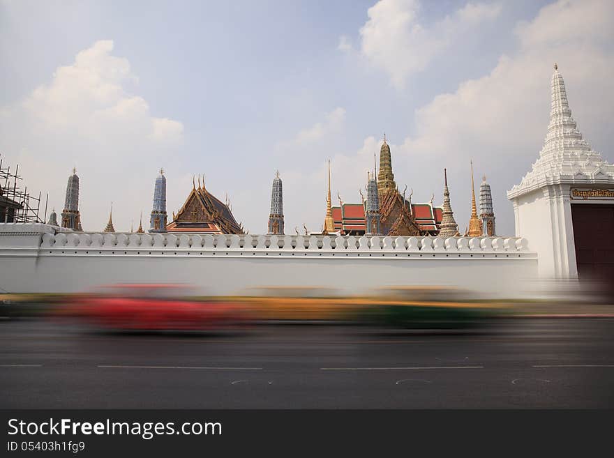 Blurred car on the street in front of Wat Phra Kaew Temple in bangkok thailand