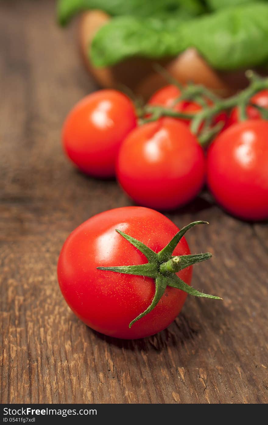 Cherry tomatoes on a wooden background