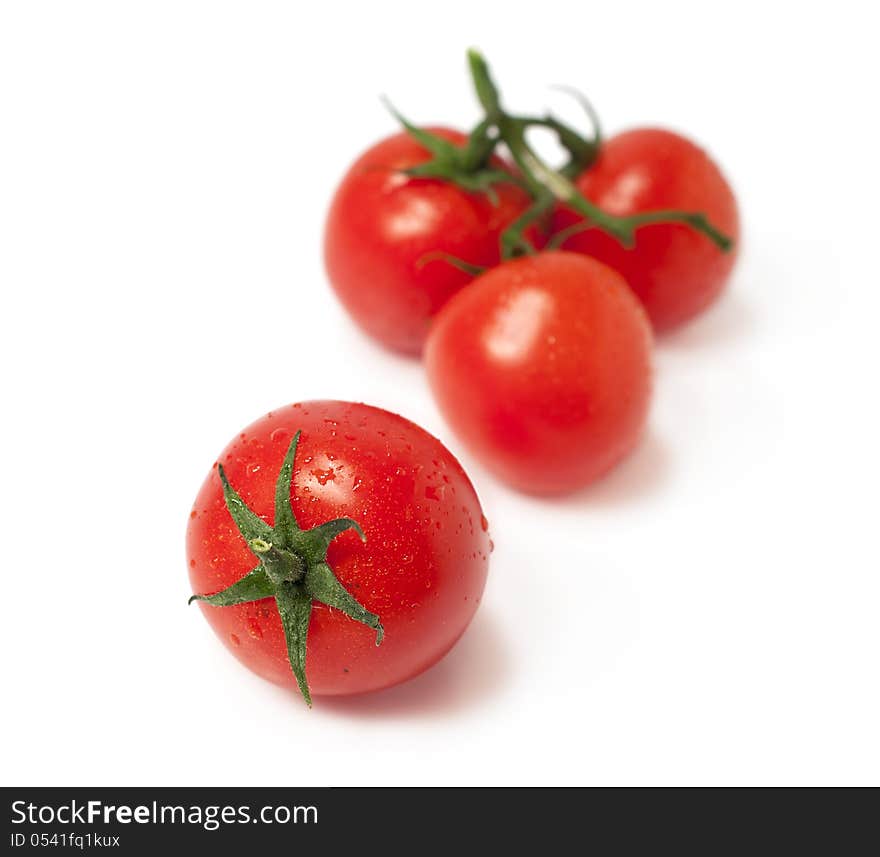 Fresh cherry tomatoes on white background