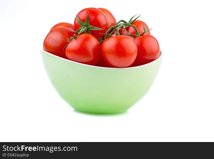 Fresh tomato in green bowl