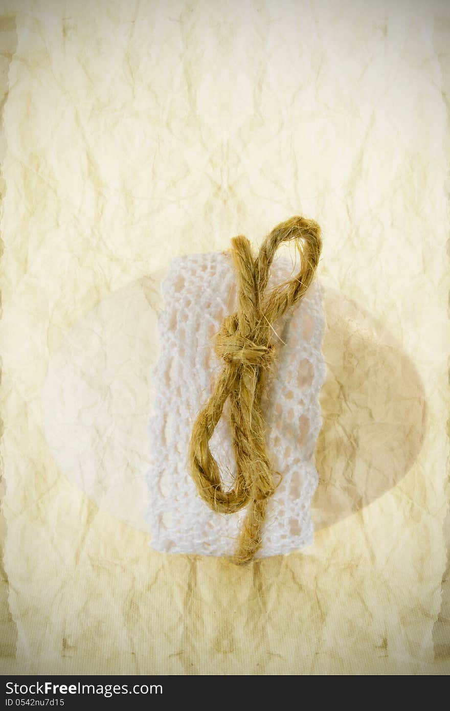 One single egg with lace and ribbon, textured. One single egg with lace and ribbon, textured