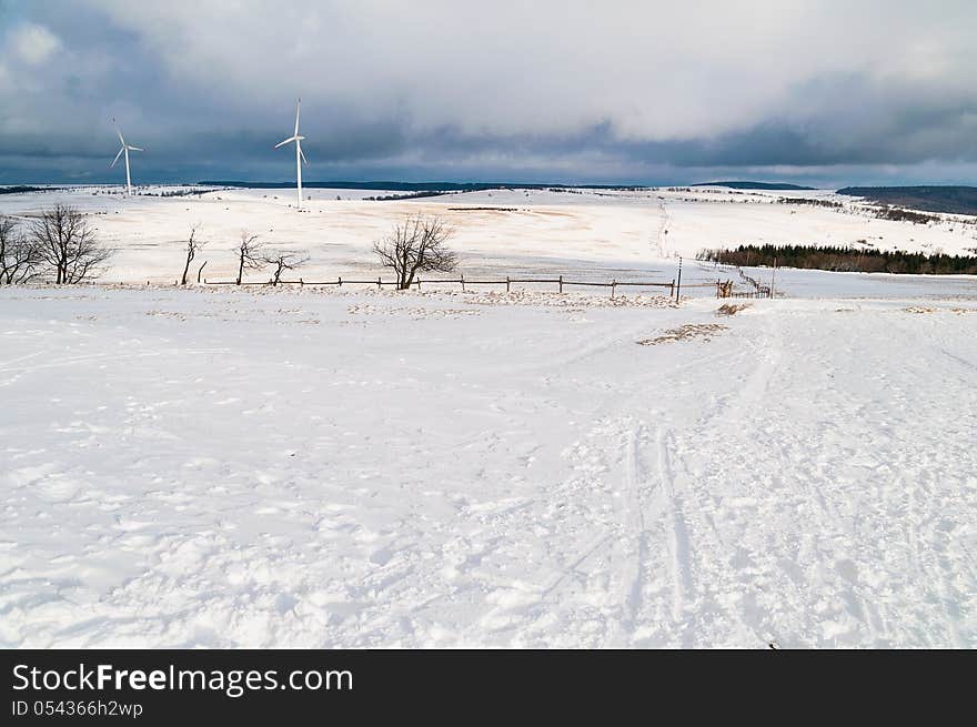 Winter landscape with two wind power