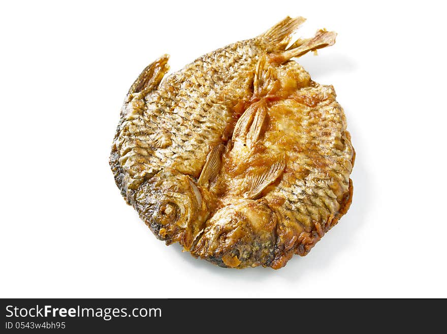 Dried fish fried on white.