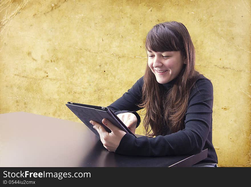 Young woman working with tablet computer. Young woman working with tablet computer