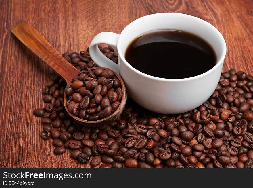 Cup of coffee with coffee beans