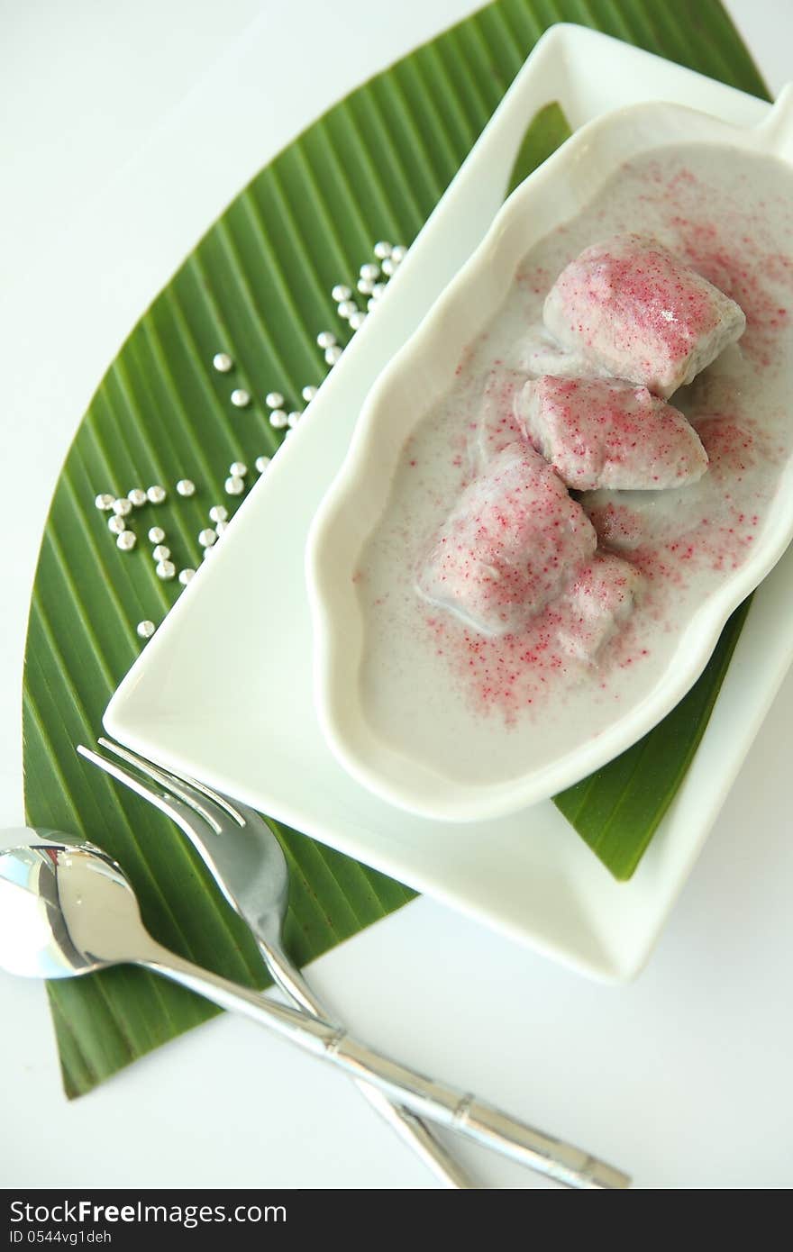 Popular Thai dessert, banana in coconut milk.