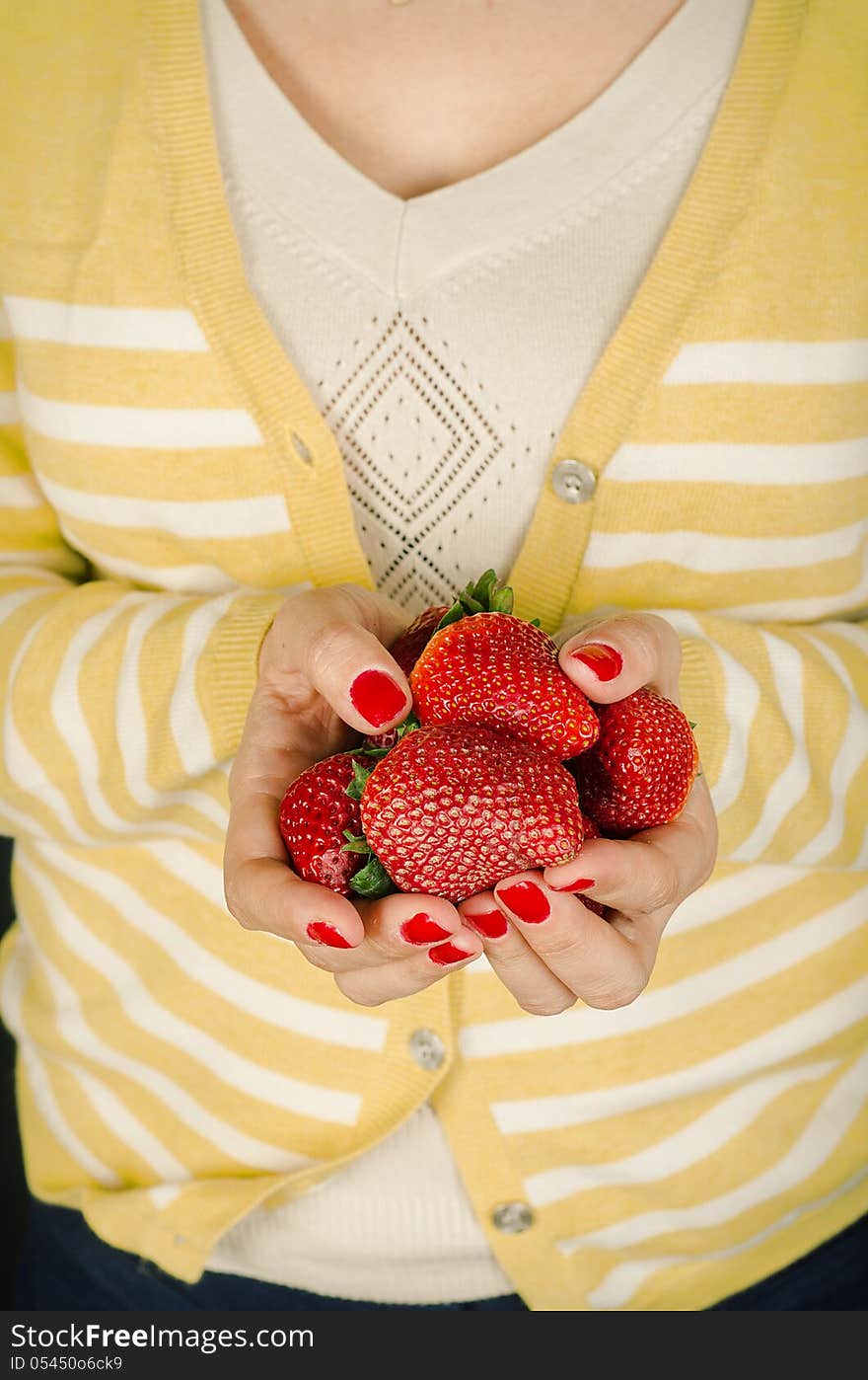 Woman holding strawberries