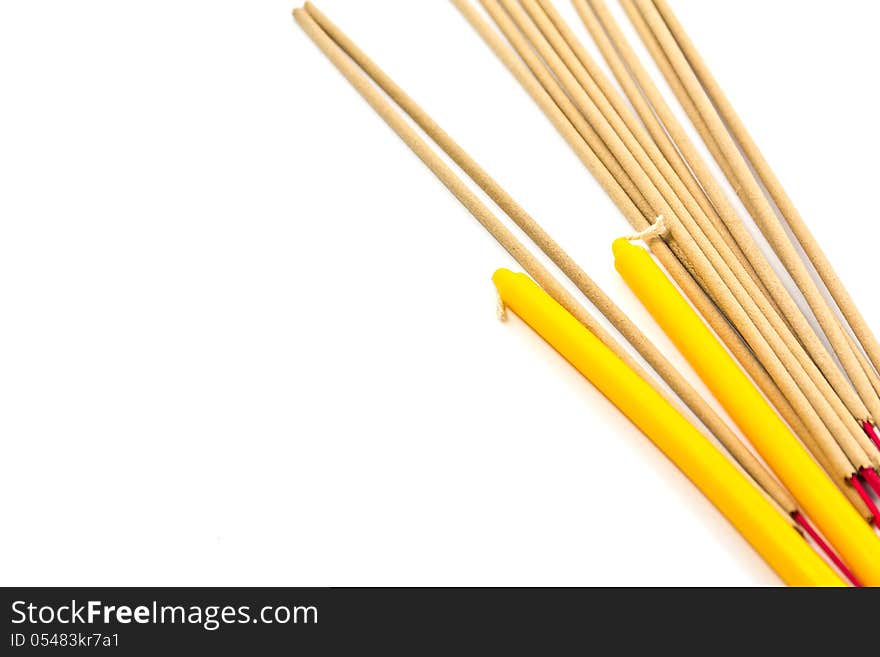 Candles and incense on a white background. Candles and incense on a white background.