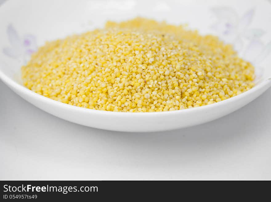 An image of yellow millets in a bowl