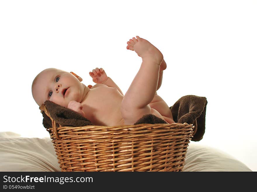 Newborn baby in the basket on white background. Newborn baby in the basket on white background