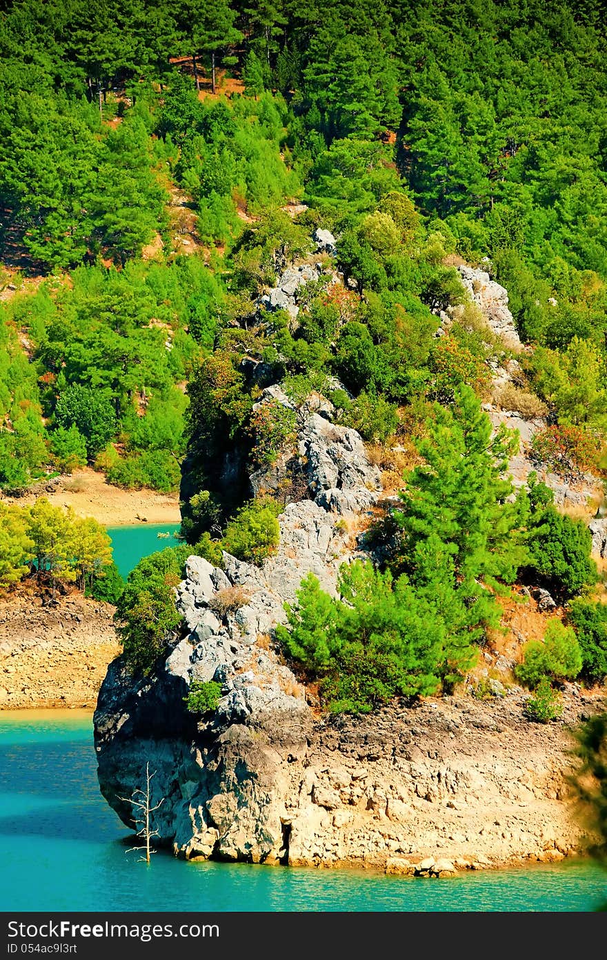 Rocky island in a mountain lake