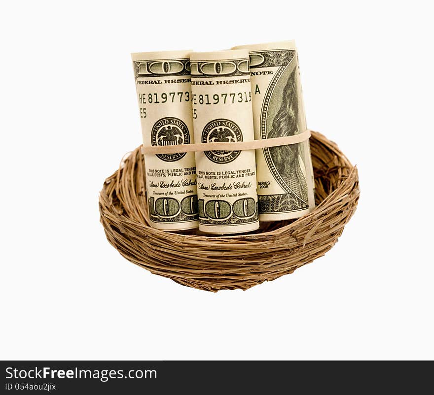 Rolls of hundred dollar bills in a nest.  Isolated on a white background. Rolls of hundred dollar bills in a nest.  Isolated on a white background.