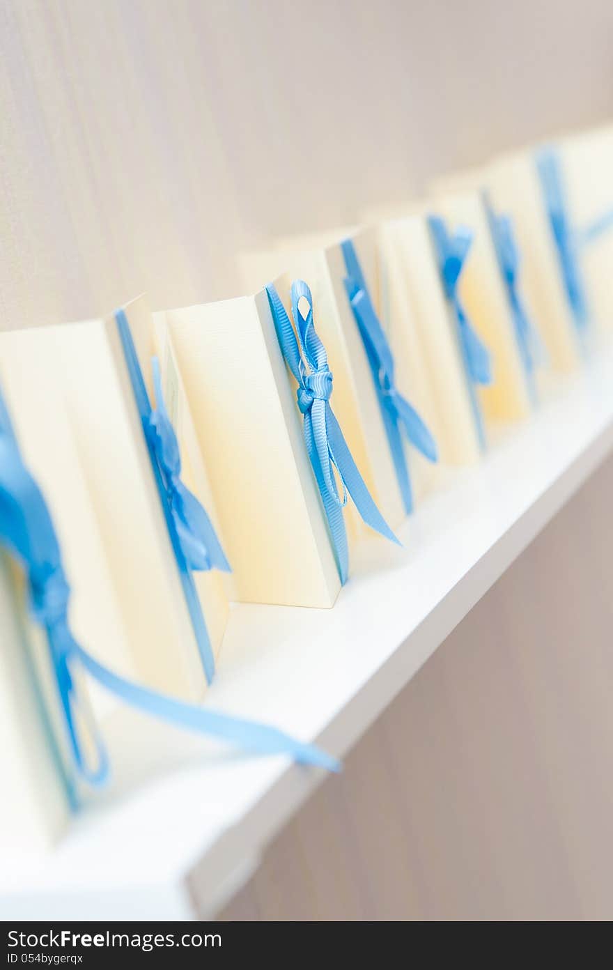 Many Blank Invitation Cards Standing In A Row