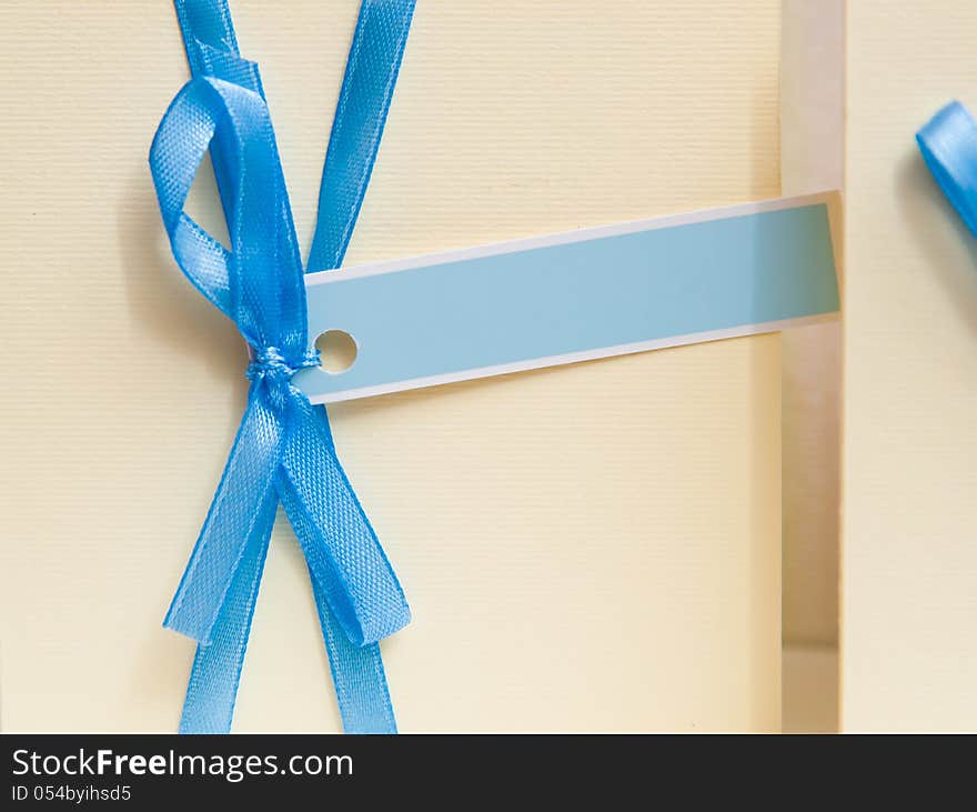 Blank invitation card with an inscription place. decorate blue ribbon bow