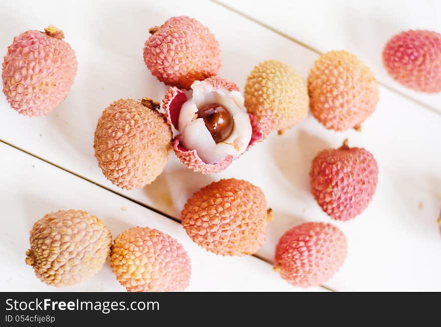 Fresh litchis on a white table. Fresh litchis on a white table