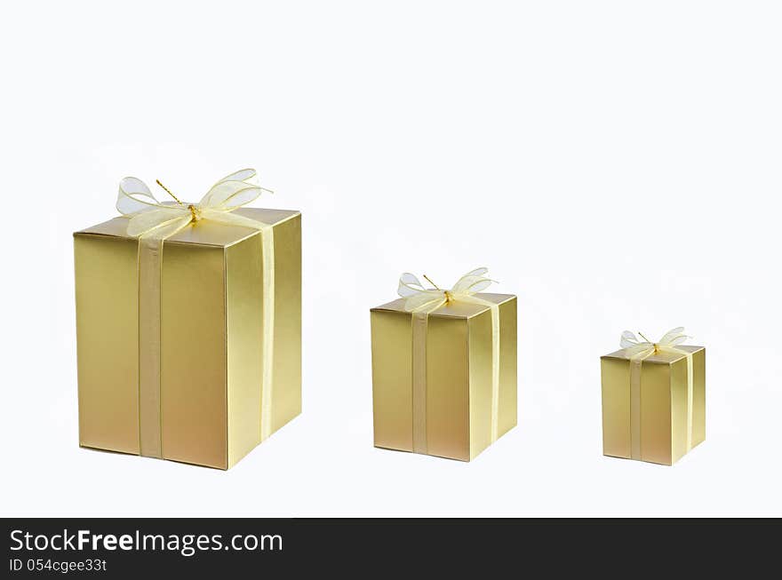 Golden gift box with ribbon on white background. Golden gift box with ribbon on white background