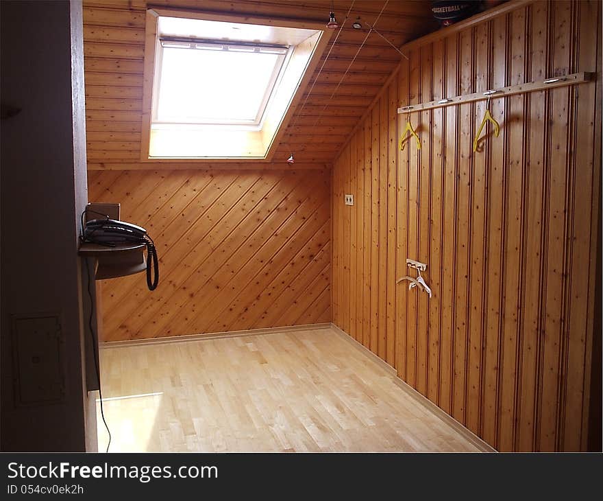 Room with wooden walls and sun window. Room with wooden walls and sun window