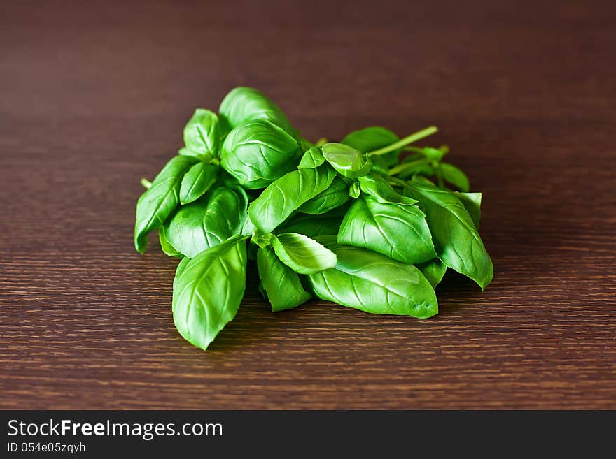 Close-up heap of green basil on a table