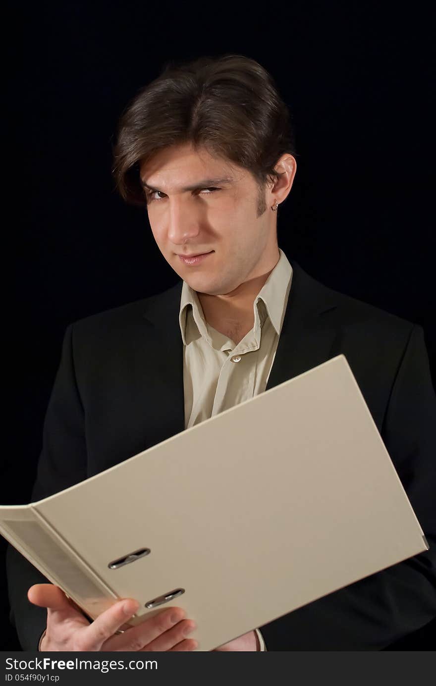 Young good looking man holding folder with documents