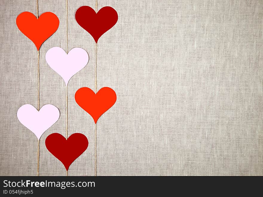 Valentine hearts garlands on linen background