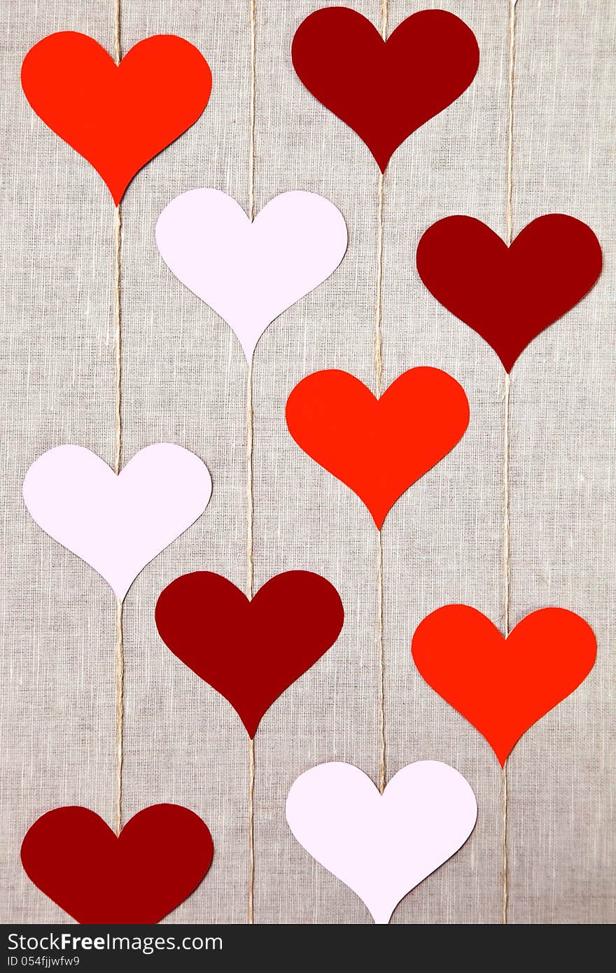 Hearts garlands on linen background