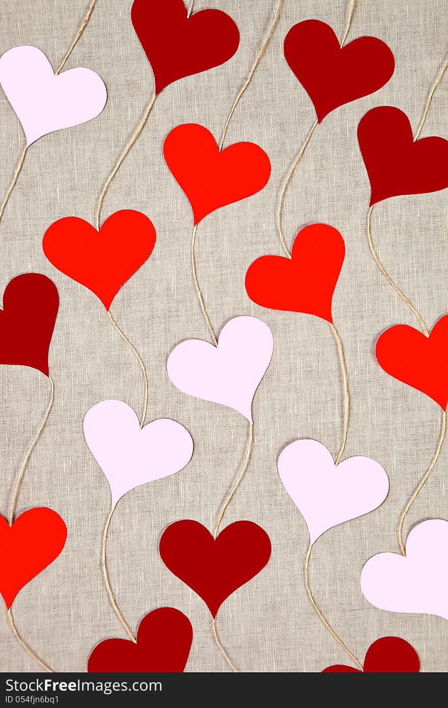 Hearts garlands on linen background