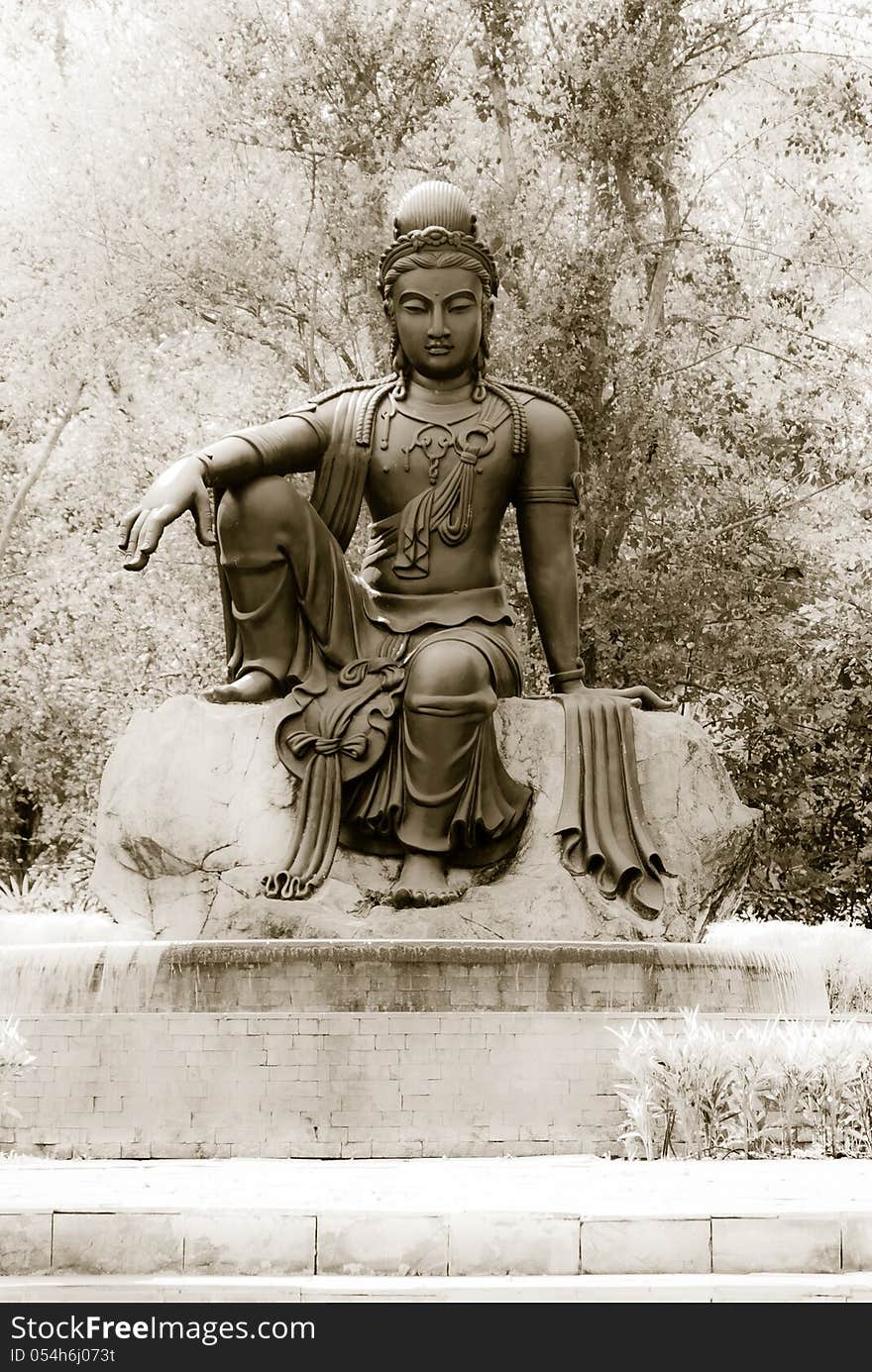 Black budha on brick with three background. Black budha on brick with three background