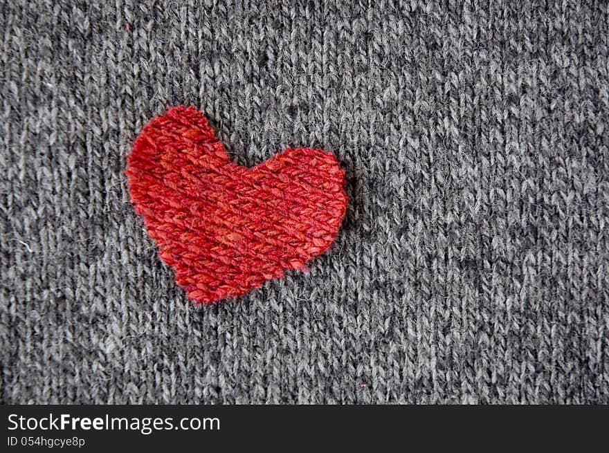 Red heart on dark fabric. Red heart on dark fabric