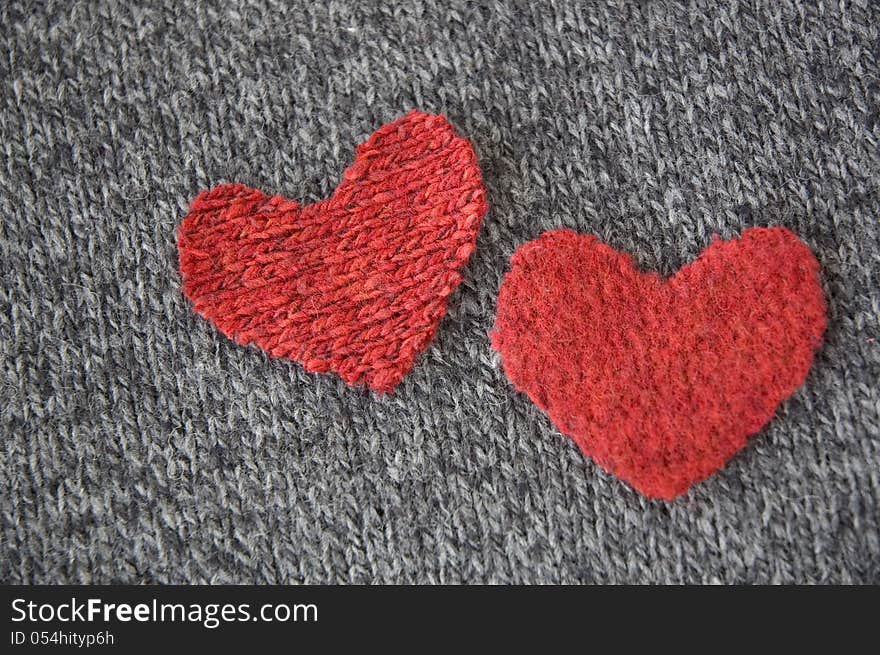 Two hearts on dark fabric