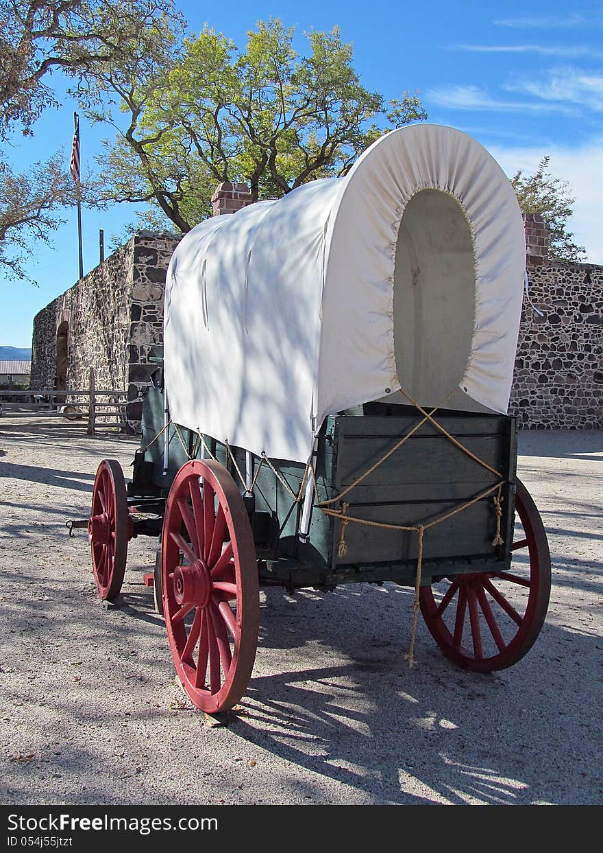 Functional replica of a pioneer era covered wagon used to settle the western United States in the 1800's. The wagon is located in Cove Fort, UT.