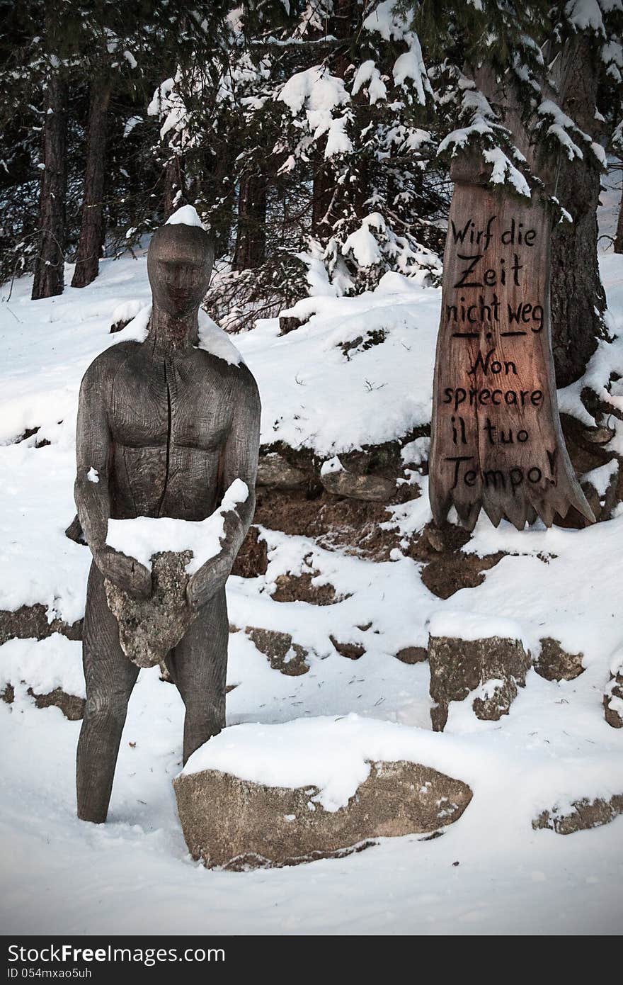 Wooden statue in the forest