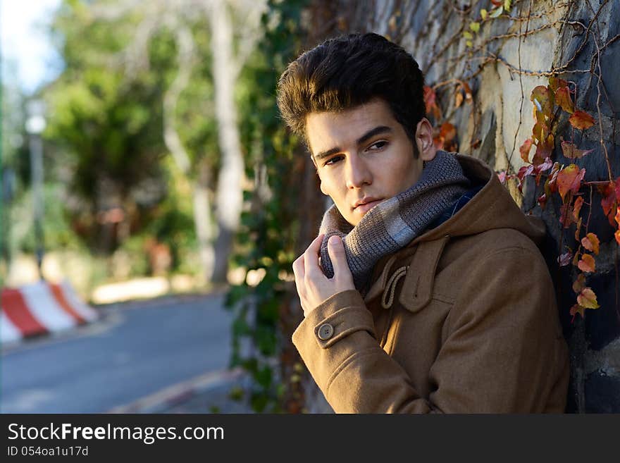 Attractive Young Handsome Man, Model Of Fashion In A Park