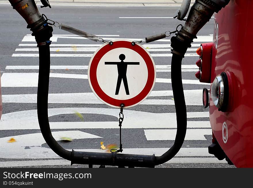 Warning sign in between tram cars in Vienna, Austria