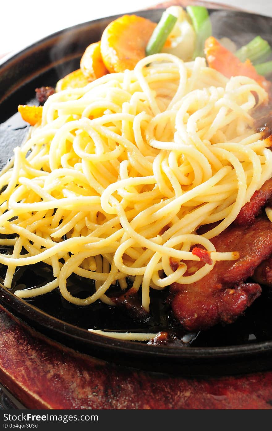 Pan fried spaghetti with pork. Pan fried spaghetti with pork