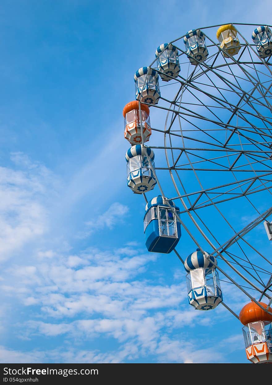 Ferris wheel in blue sky