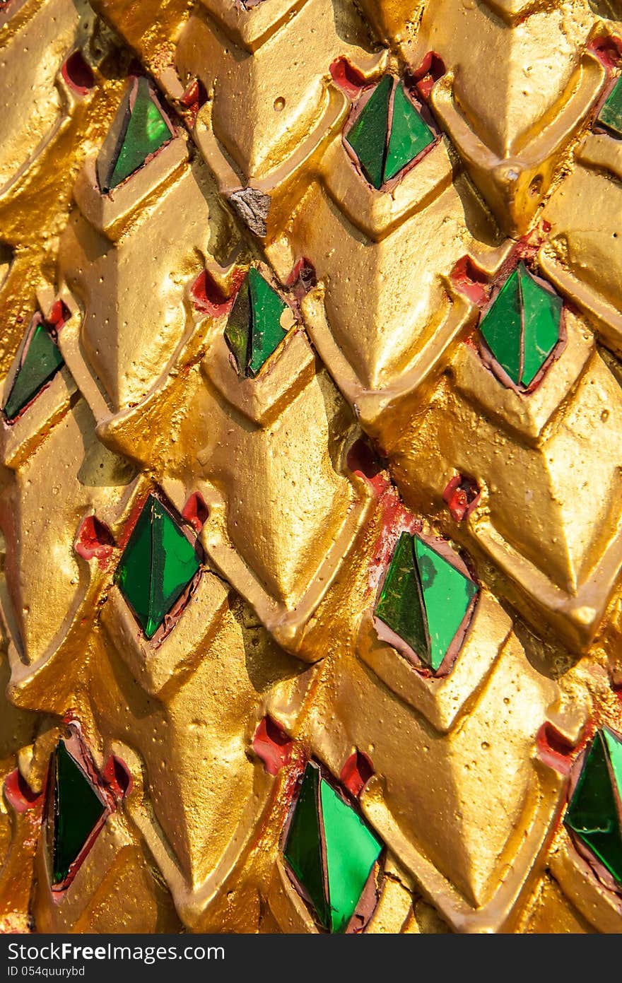 Gold and green dragon scale pattern