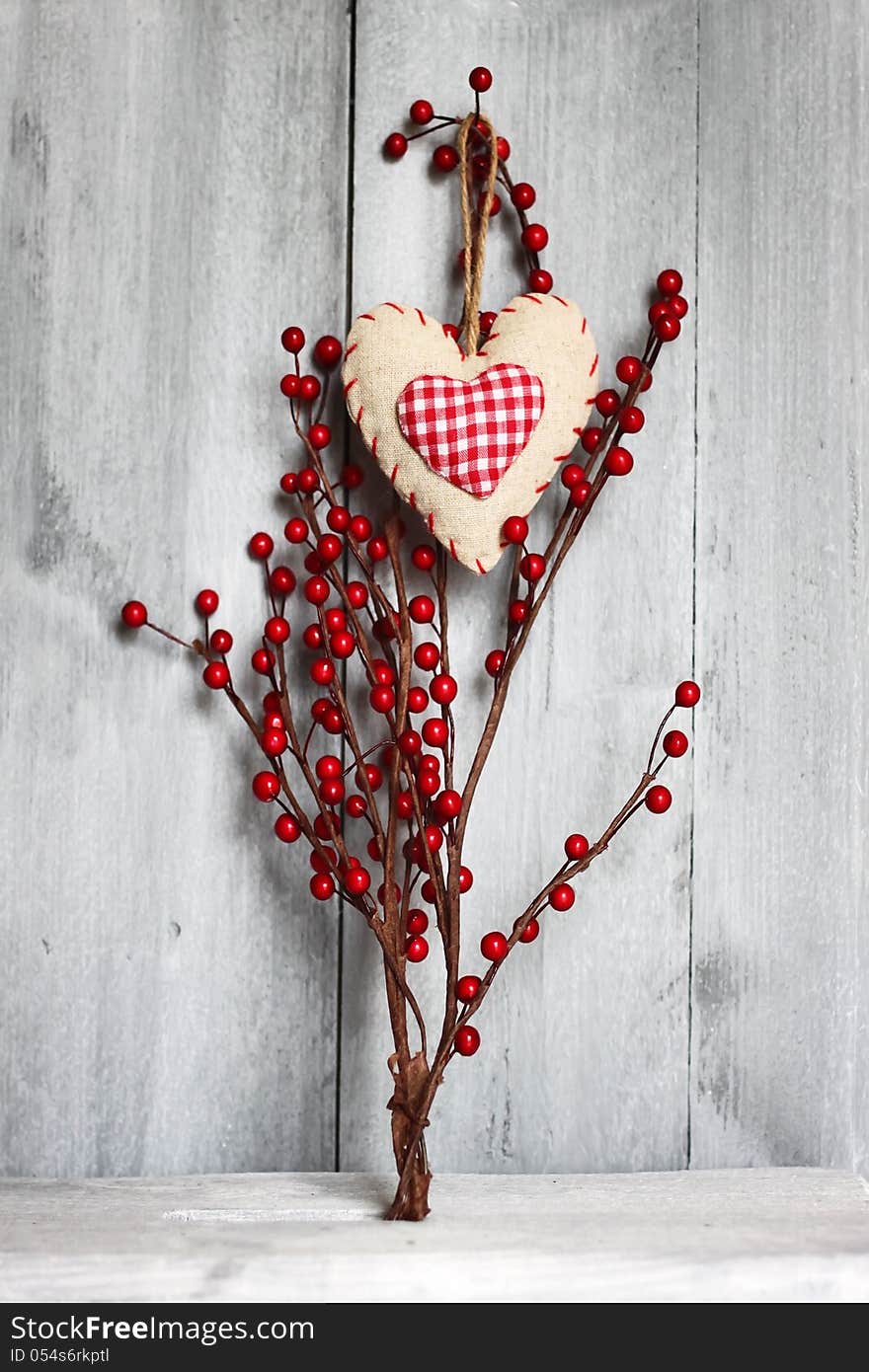 Photo of fabric heart on wooden background