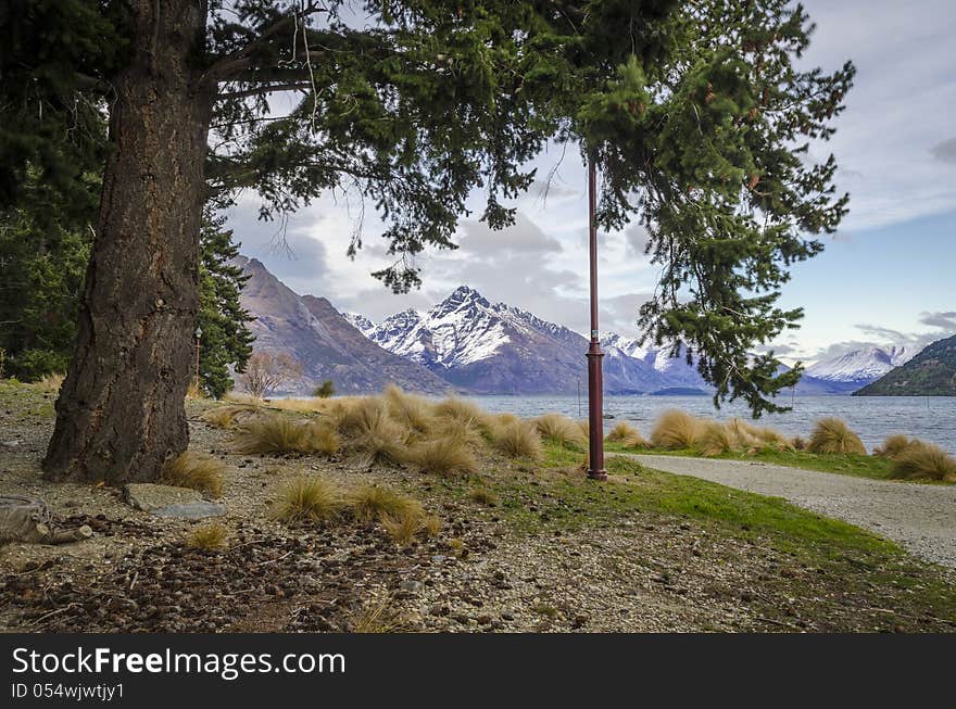 View of distant mountains through forest trees. View of distant mountains through forest trees